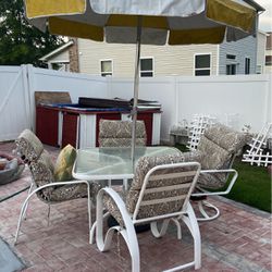 A Nice Outdoor Table With Four Chairs 