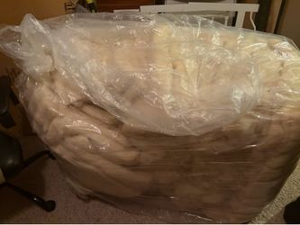 That’s okay. Based on the photo alone, here’s what I think is most likely.  The bale looks like raw upholstery filling or batting that has been compre