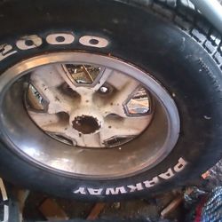 235/60/R14 Tire And 5 Lug Rim. 