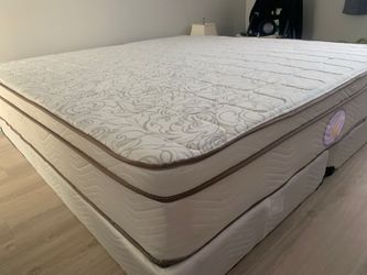 New king mattress and box springs bed frame is not included
