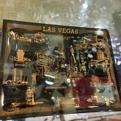9x7 smoky glass vintage LAS VEGAS tray or ashtray. Notice the TROPICANA HOTEL which was closed as of April.  35.00.  Johanna at Antiques and More. Loc