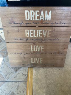 Dream, Believe, Love, Live" signs are popular inspirational home decor pieces. 20”X20”