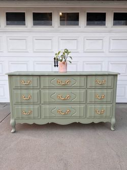 Beautiful sage green dresser with gold hardware