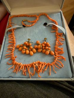 Real coral necklace straight from the Bahamas with earrings that match coral color . Earrings have screw on backs.