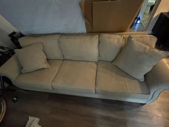 Beige couch with cushions