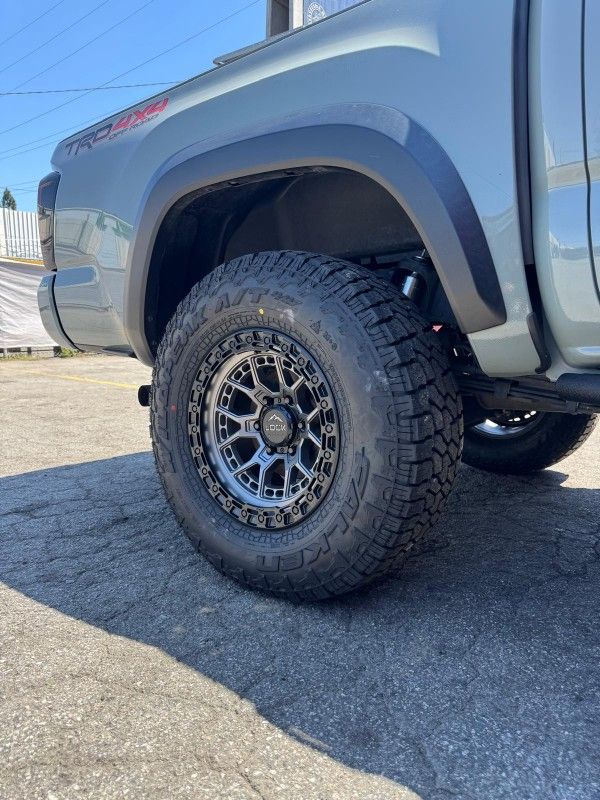 LOCK COMMANDO AND 33" FALKEN TIRE WHEEL AND TIRE PACKAGE