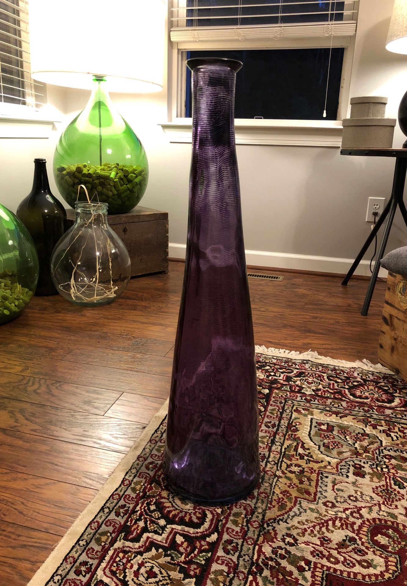 Large, decorative glass bottle