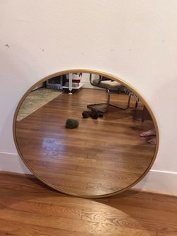 Gold round mirror