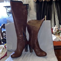Never worn UGG leather knee high 4” heel with 1/2” platform