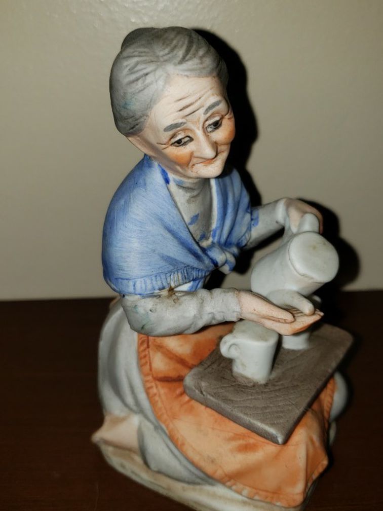 Old woman with her tray and tea set