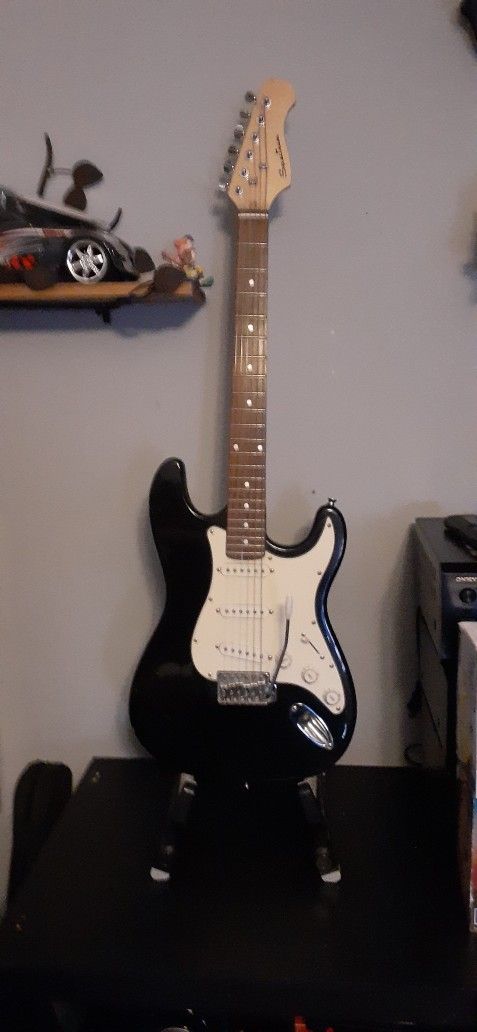 1 MINI ELECTRIC GUITAR $50 I ACOUSTIC GUITAR NEEDS NEW STRINGS 3/4 SIZE ..30" NEON GUITAR WITH CLOCK $20 CLICK ON PICTURE YOU WILL GET FULL PICTURE