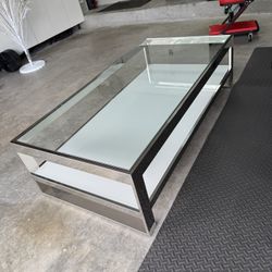 Rectangle  Coffee Table, Heavy, was $1,100. Stainless Steel Frame, Tempered Glass, Perfect Condition Size: 55W x 15H x 27.                      