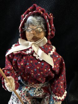 Antique doll with churning butter stick