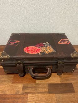 Vintage antique Suitcase with Travel Stickers