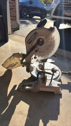 Delta ShopMaster sliding compound miter saw, which appears to be a 10-inch or 12-inch model like the S26-262L or S26-272L equipped with a laser guide