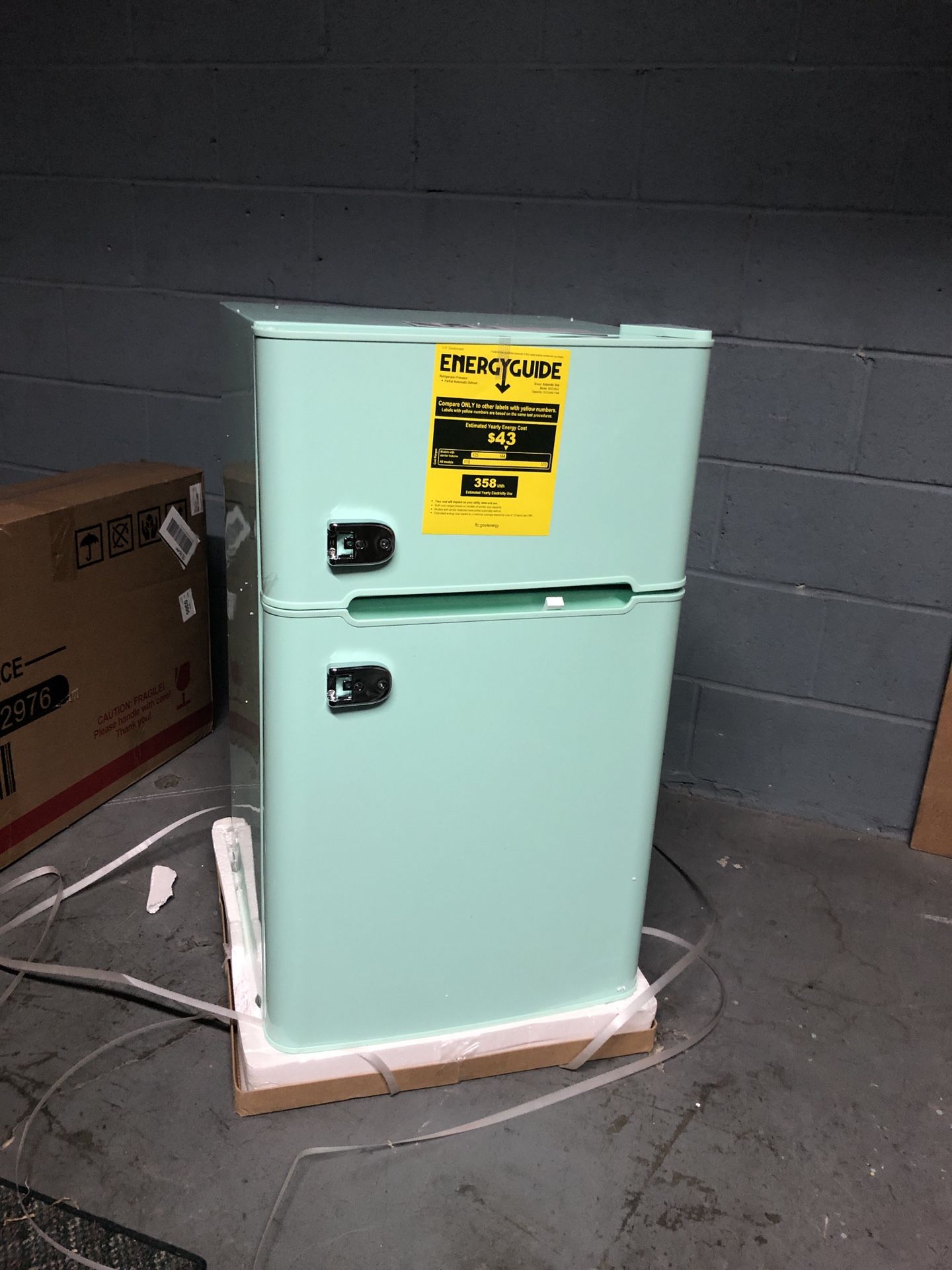 Compact Mini Refrigerator with Separate Freezer in the box with small dent on one side