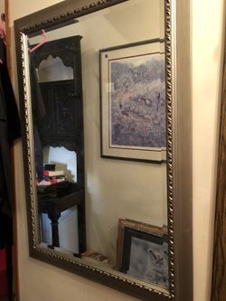 Silver tone mirror