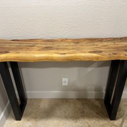 4’6” Raw edge, iron legged console table. $150