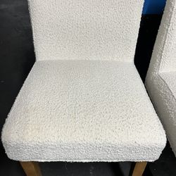2 white comfortable chairs 