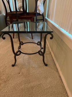 Glass and metal end table from Greenbaum Home Furnishings