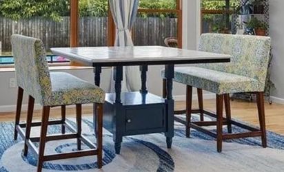 Tile top dinner tables set with bench seats