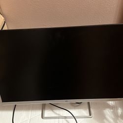 Montior And Desktop With Keyboard And Mouse