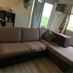 Sectional With Pull Out Bed And Outlet Shelf