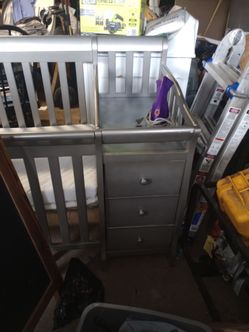 3 drawer crib with matching rocker and ottoman glider./ Grey