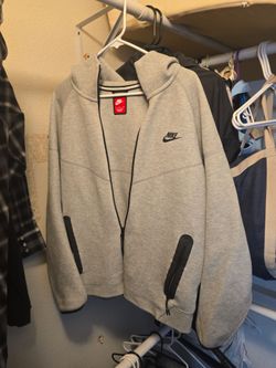 Large Gray Nike tech.