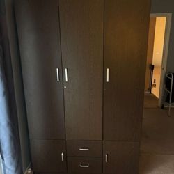 Very spacious 3 door closet with pull out drawers and shelves. Elegant brown color with vintage look. Can be disassembled. Heavily discounted price.