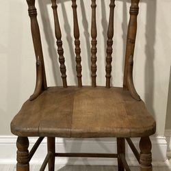 A beautiful Antique carved wood chair with solid wood seat