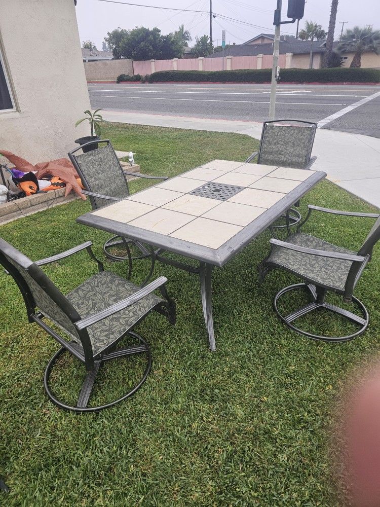 Patio Table And Swivel Chairs 