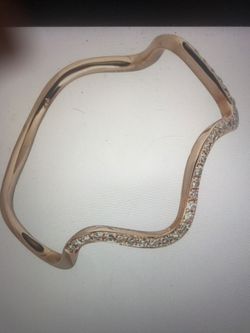 14k pink gold wave ring with 0.09ct diamonds