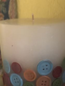 Large candle with buttons. New