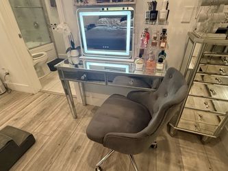 Mirrored vanity with light included and chair