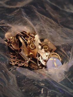 Mixed bags of pins and cufflinks