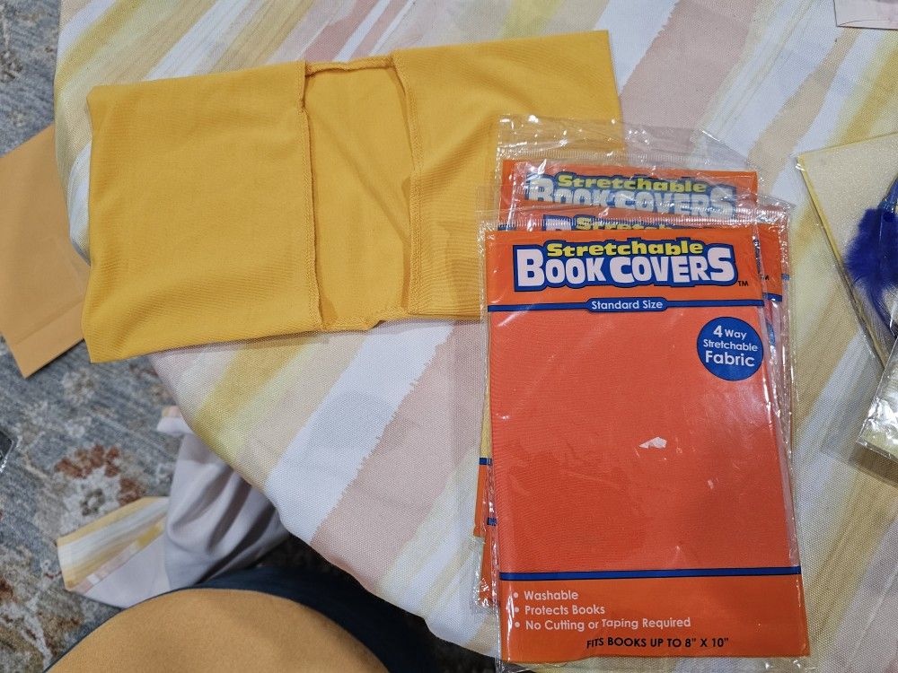 Never used, 5 stretchable fabric book cover