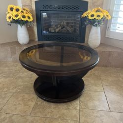 Round wood table with glass top  with coasters for easy movement