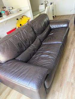 2 brown leather couches