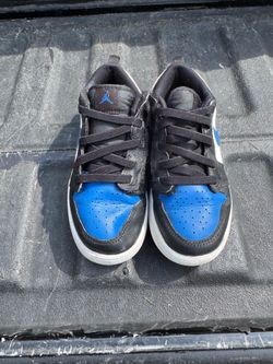 Nike Air Jordan 1 Low Alt sneakers in a black, blue, and white colorway. Children’s 1.5Y
