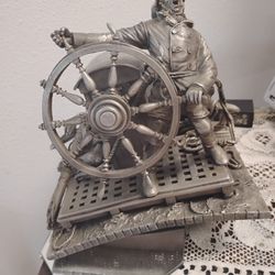 A Franklin Mint Sculpture Titled Into The Storm 