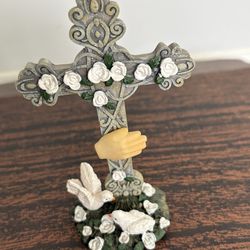 Decorative figurine, religious table top centerpiece referred as an ivory cross with doves