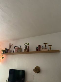 Two floating faux wood shelves