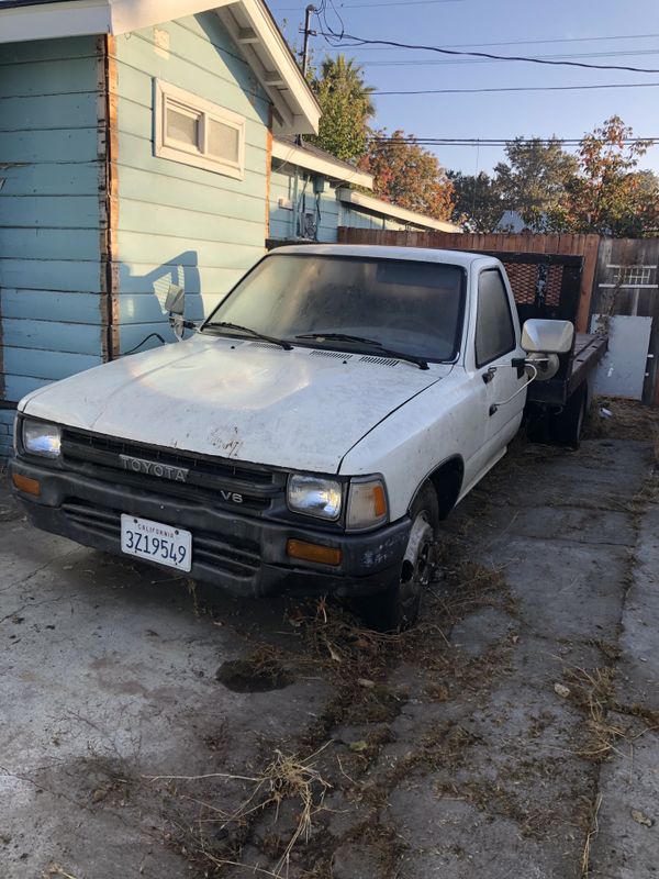 1991 Toyota pickup 1 ton flat bed with metal stakes for Sale in Colma