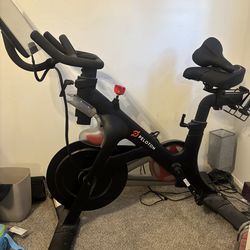 Original Peloton Bike wirh spare seat and pedal adapters