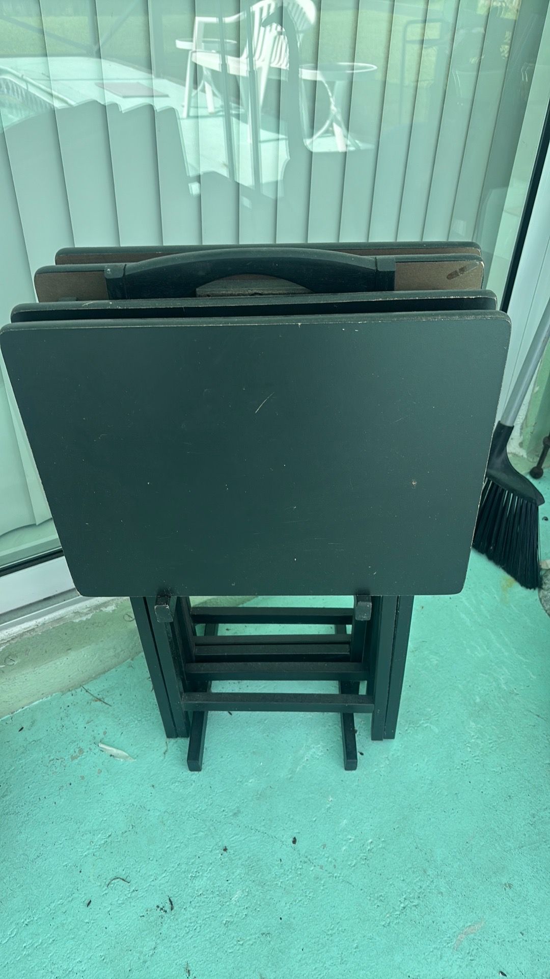 Four TV trays with stand