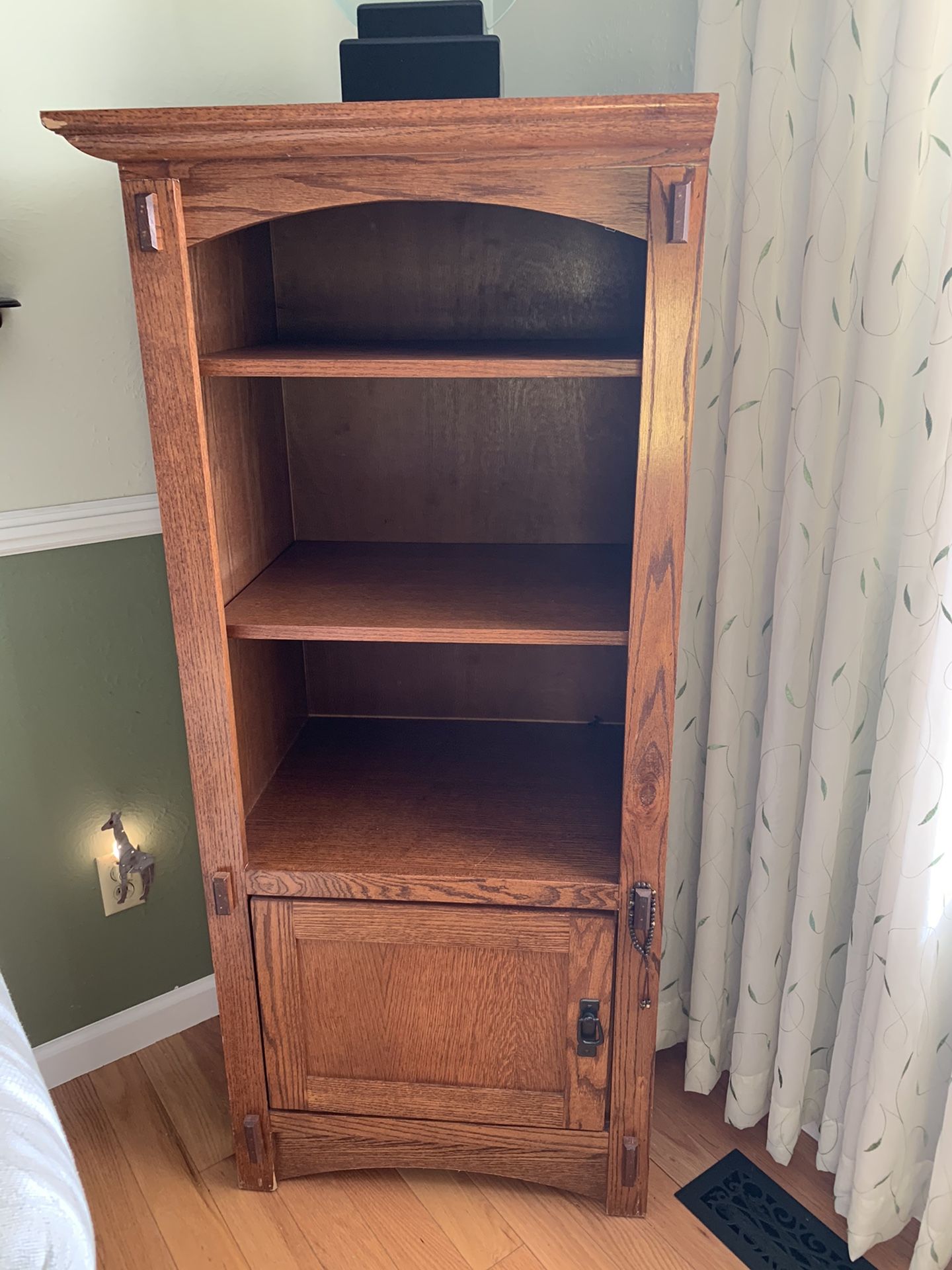 Hutch with 3 layered shelves and door cabinet for storage.