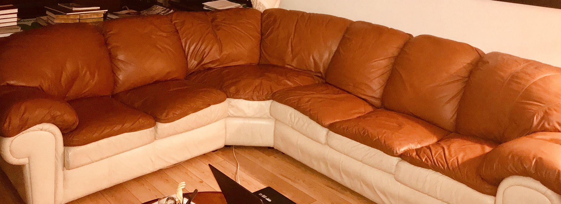 3 piece sectional real leather sofa. (Burnt Orange and Cream). Very comfy.