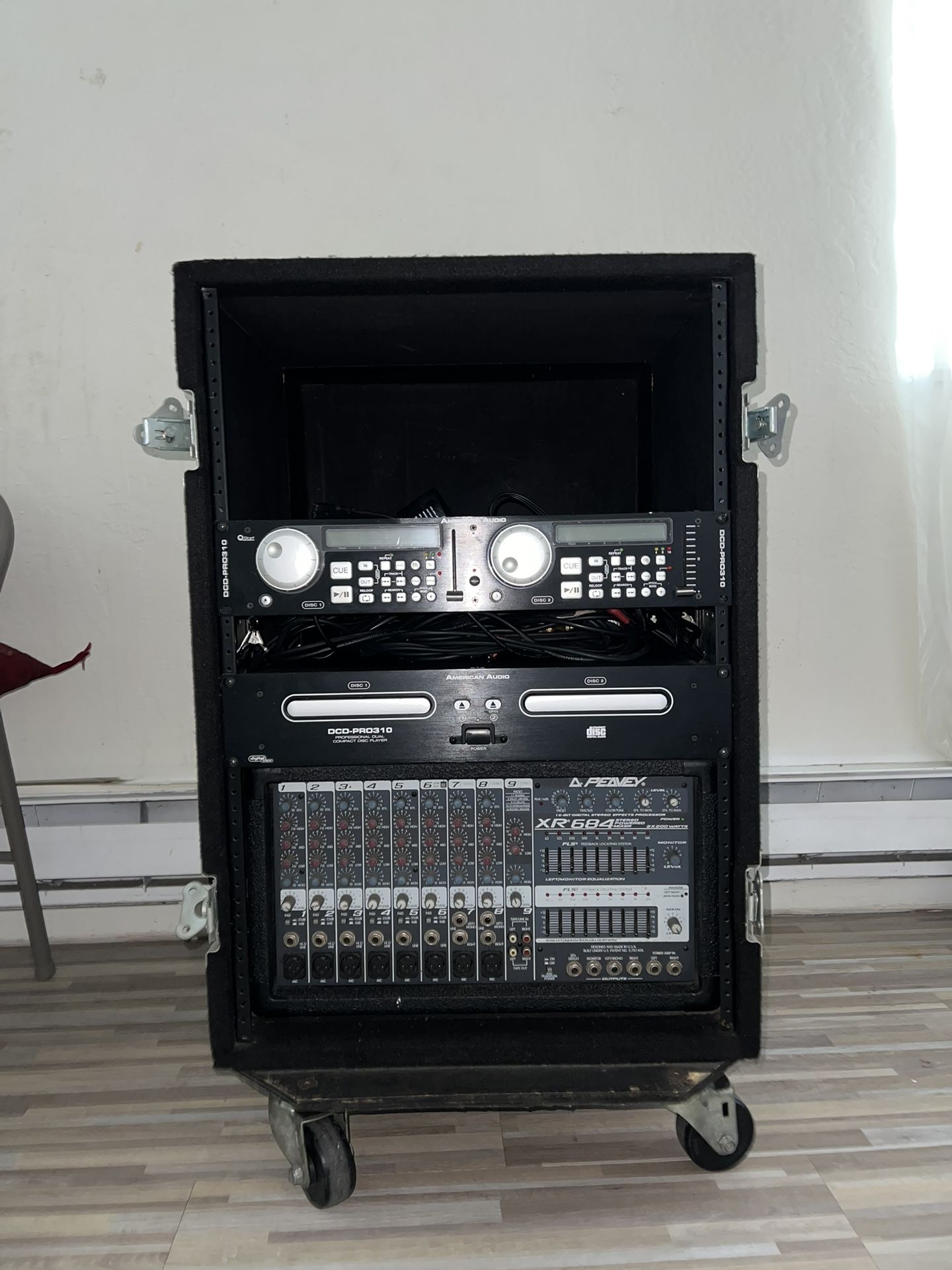 Peavey XR684 stereo powered mixer with an American Audio DCD-PRO310 dual CD player