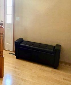 Dark brown tufted storage bench